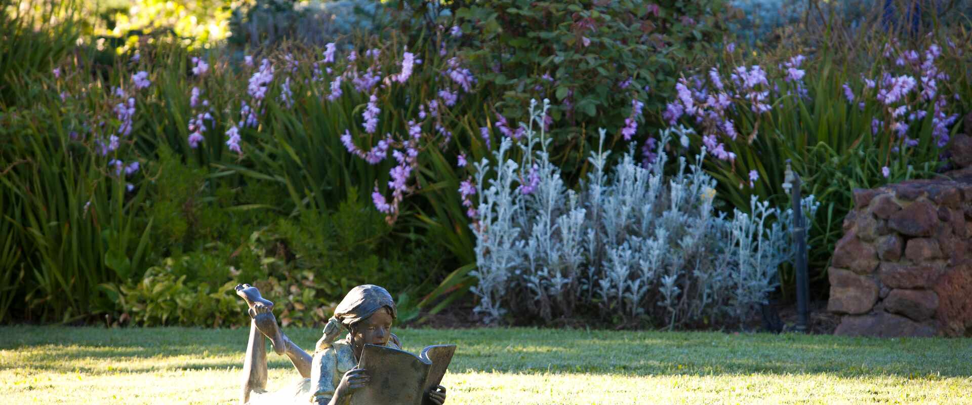 garden sculpture girl reading wiltshire judy vanrenens property victoria, australia